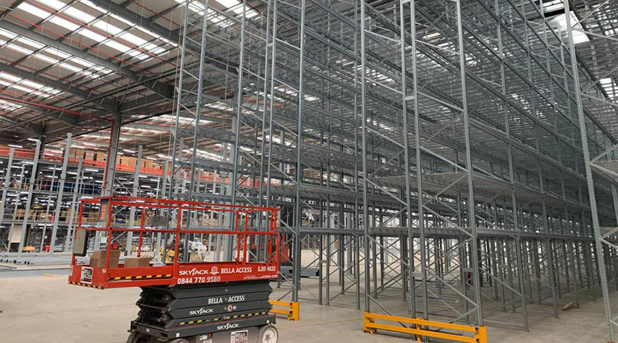 warehouse scaling with new pallet racking system being installed 