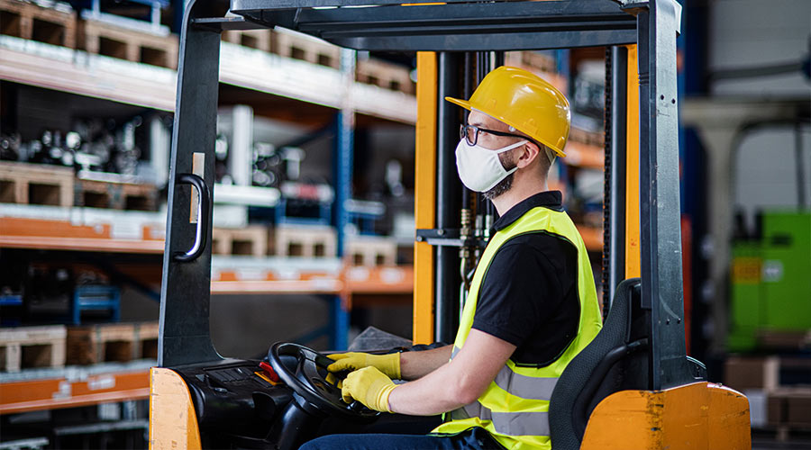 warehouse worker wearing protective equipment