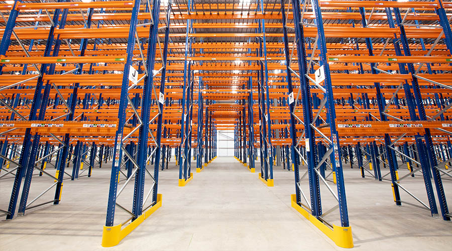 Wide aisle pallet racking in a warehouse