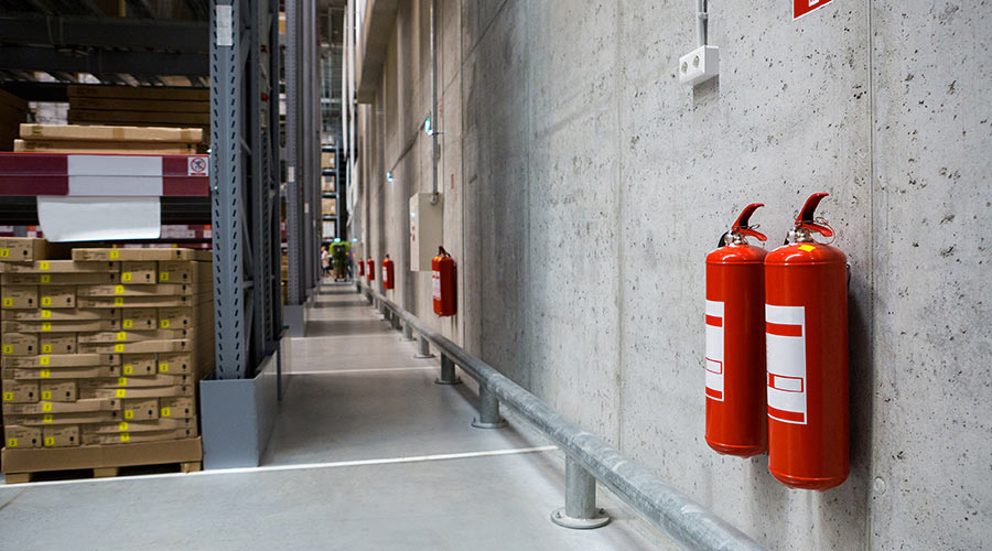 fire safety in a warehouse with fire extinguishers