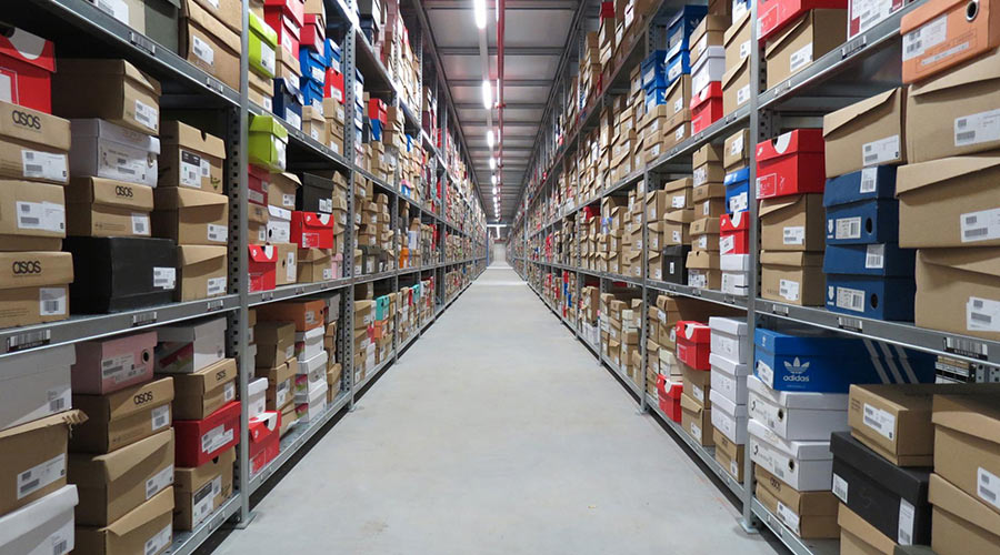 Wide aisle industrial shelving in an empty warehouse