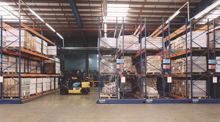 mobile warehouse racking and a forklift