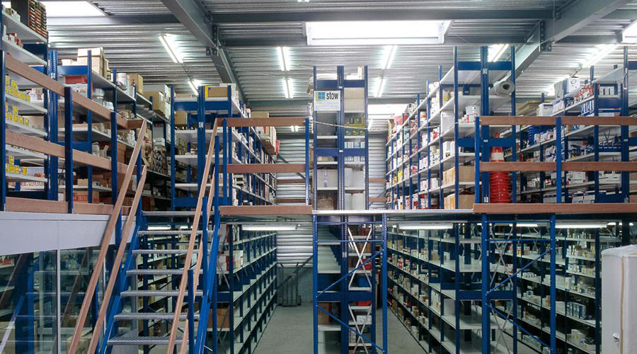 top floor of a multi-tier shelving system in a warehouse