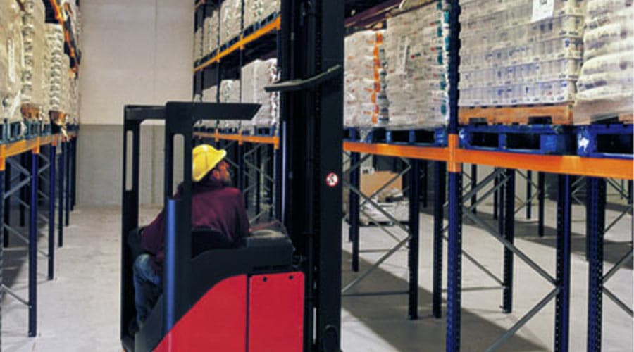 wide isle pallet racking with a fork lift