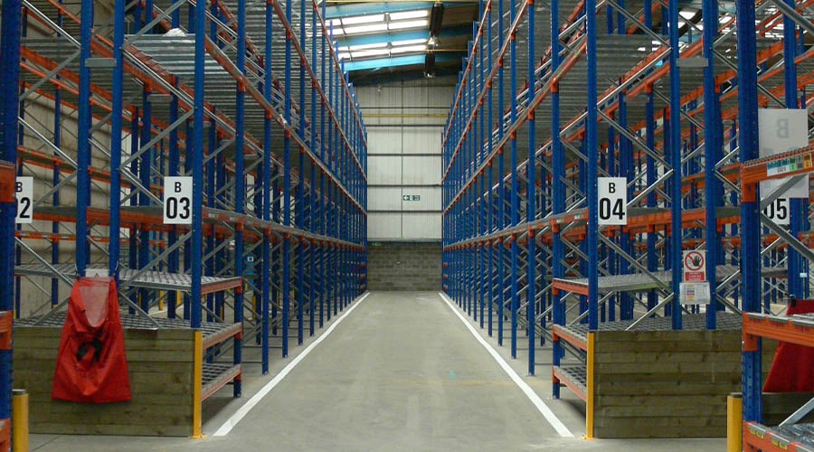 wide isle pallet racking in a warehouse